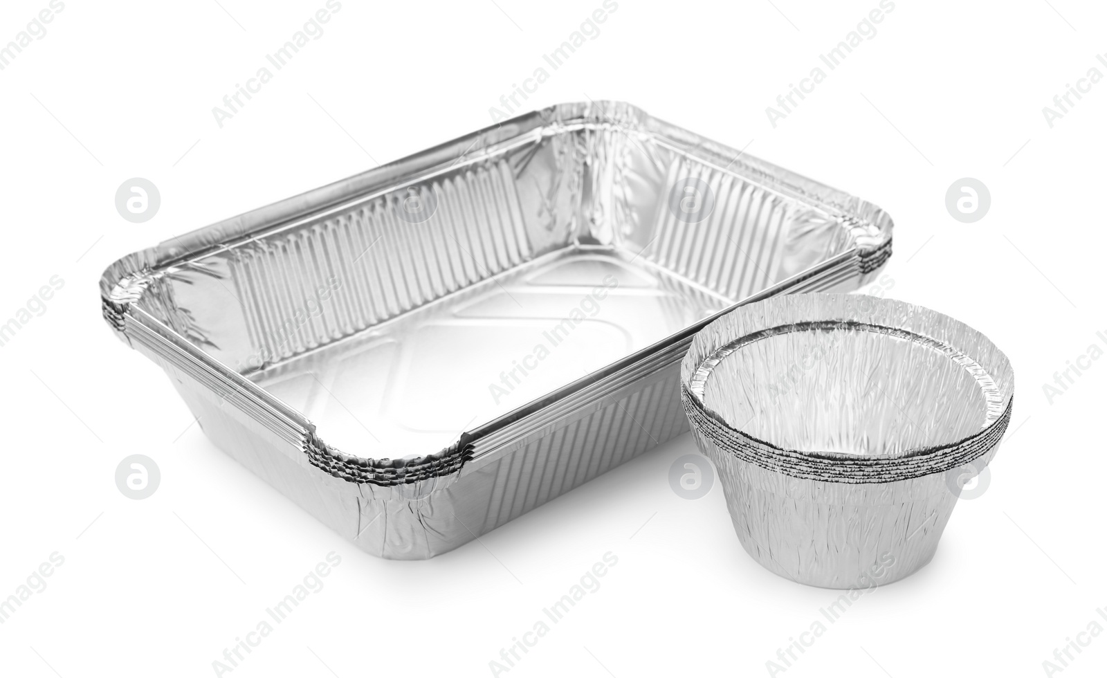 Photo of Many different aluminum foil containers isolated on white