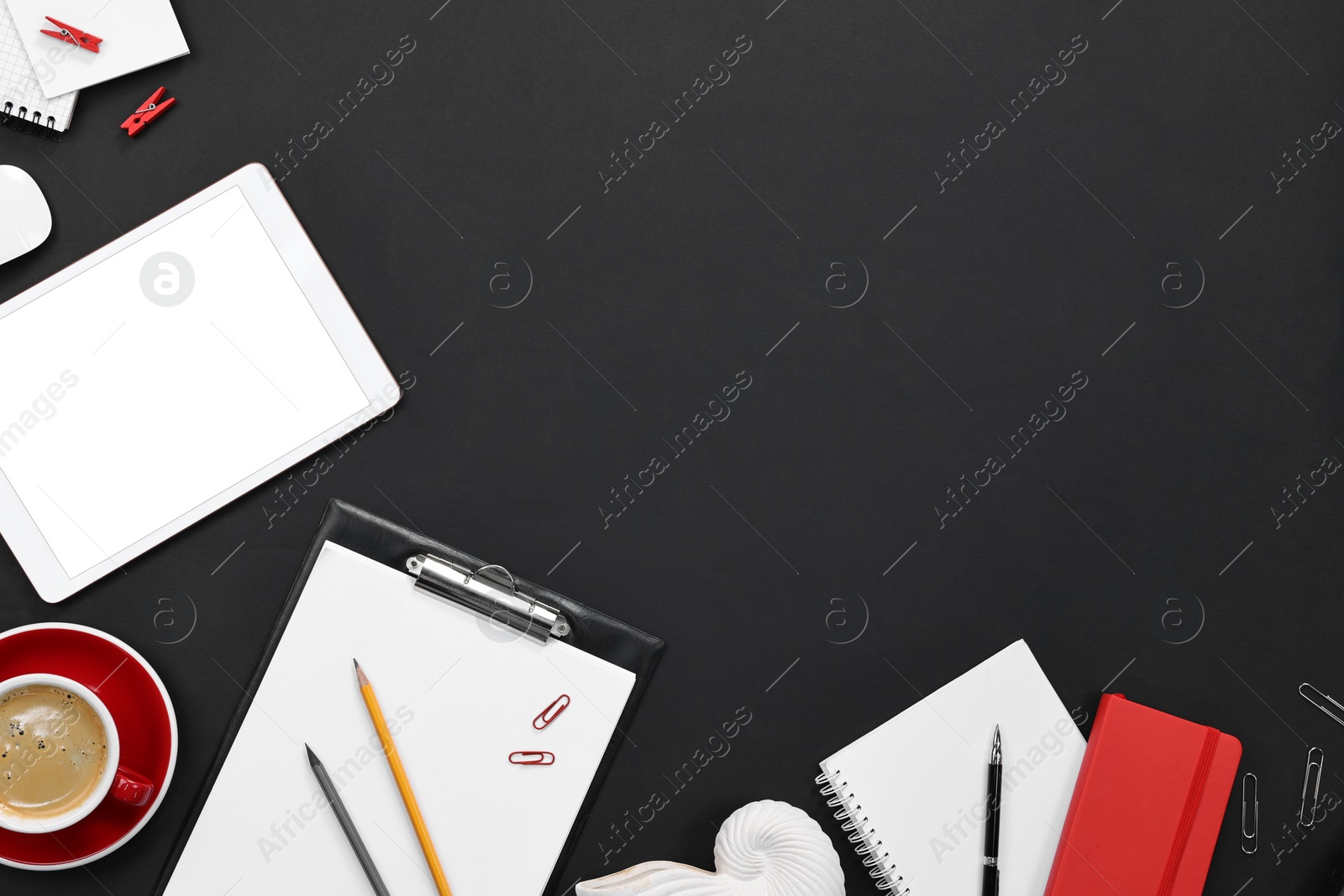 Photo of Flat lay composition with modern tablet on black background. Space for text