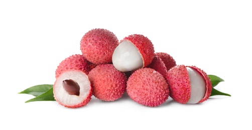 Pile of fresh ripe lychees with green leaves on white background