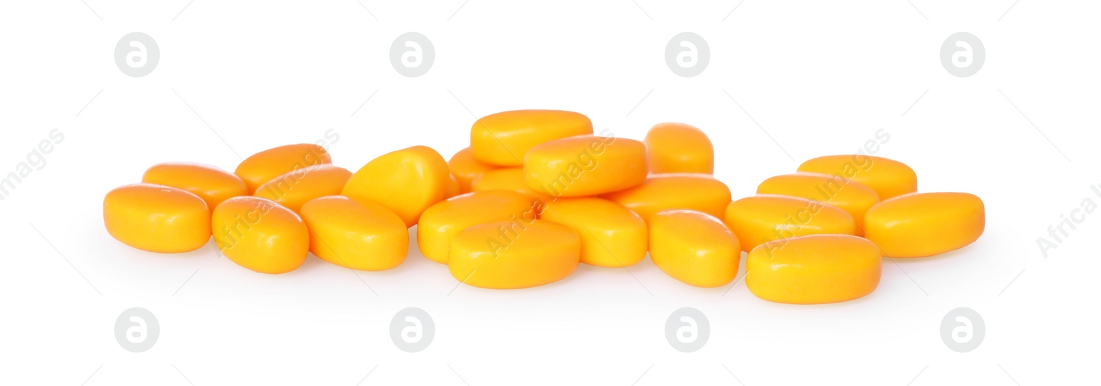 Photo of Tasty orange dragee candies on white background