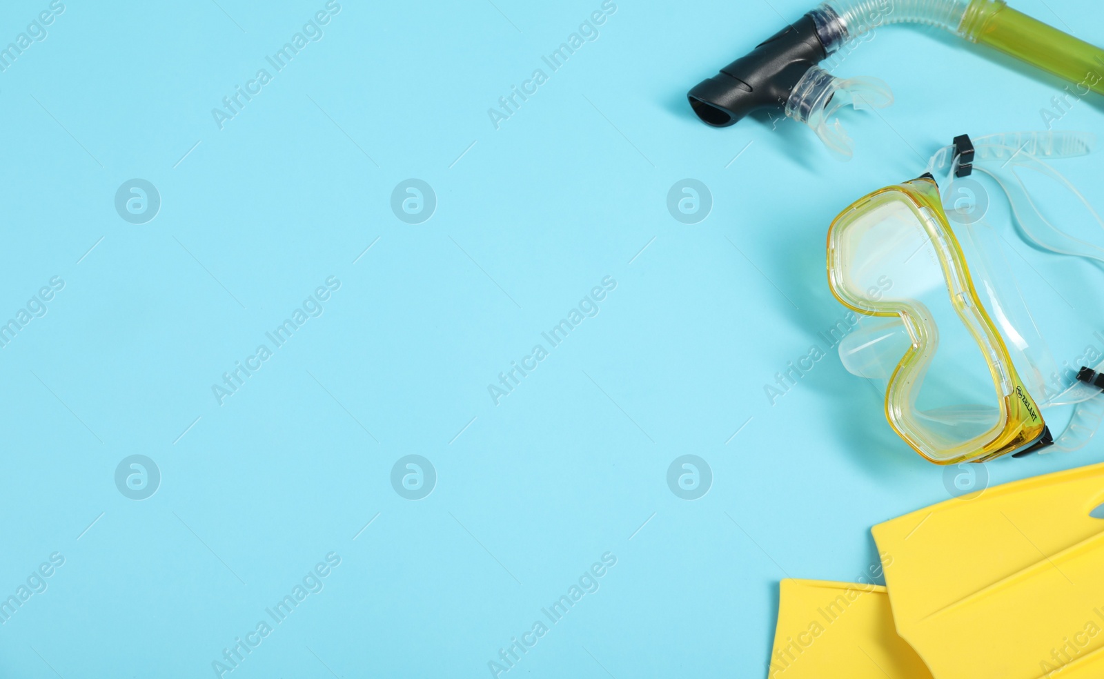 Photo of Different sports equipment on light blue background, flat lay. Space for text