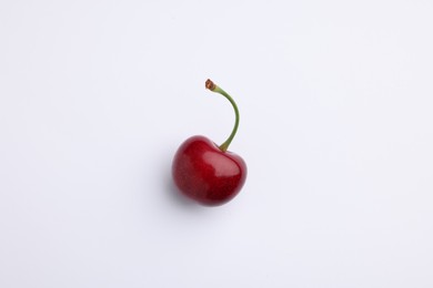 One ripe sweet cherry on white background