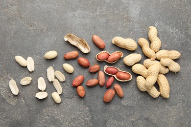 Photo of Fresh peanuts on grey table, flat lay