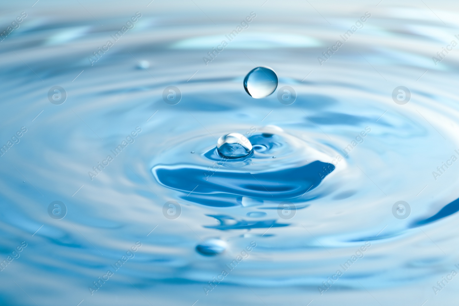 Photo of Splash of clear water with drops as background, closeup