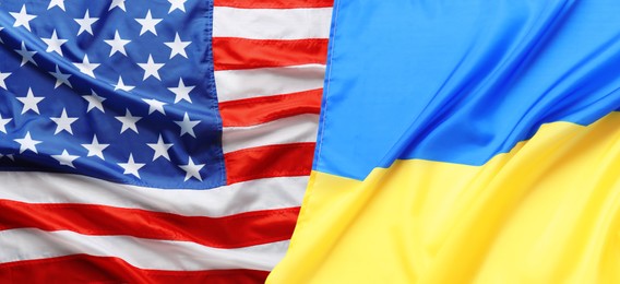 National flags of Ukraine and USA symbolizing partnership between countries. Banner design