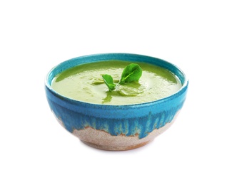 Photo of Bowl of broccoli cream soup with microgreens on white background