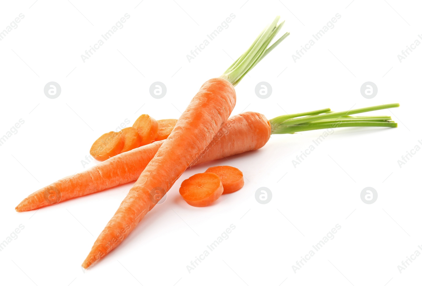 Photo of Whole and cut fresh carrots on white background