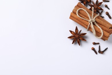 Photo of Different spices on white background, flat lay. Space for text