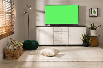 Image of Chroma key compositing. TV with mockup green screen in room. Mockup for design