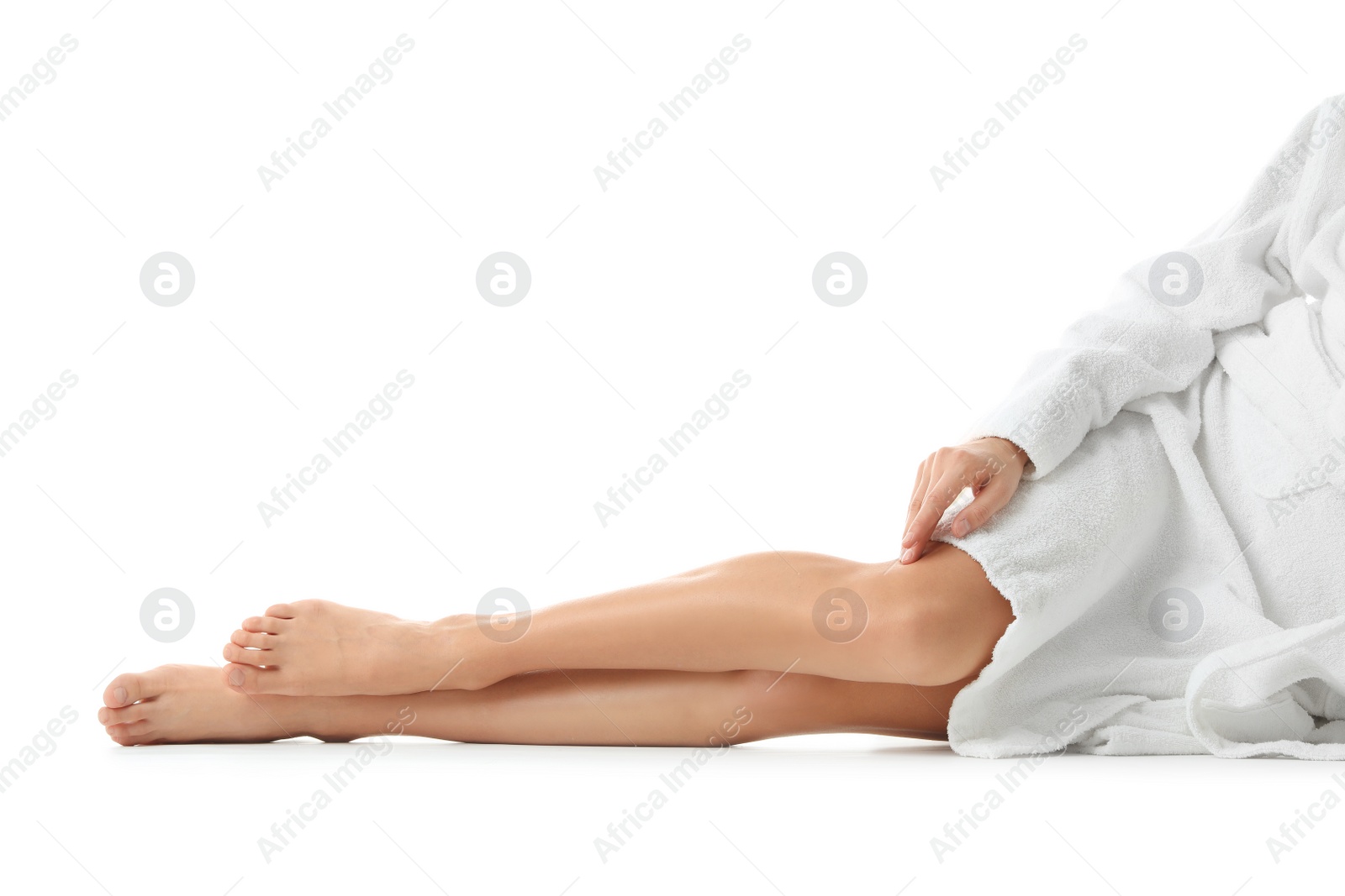 Photo of Young woman with beautiful long legs on white background, closeup