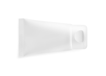 Photo of Blank tube of cosmetic product on white background, top view