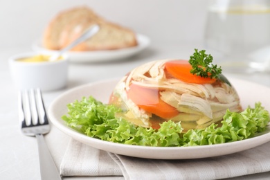 Delicious chicken aspic served on light table, closeup