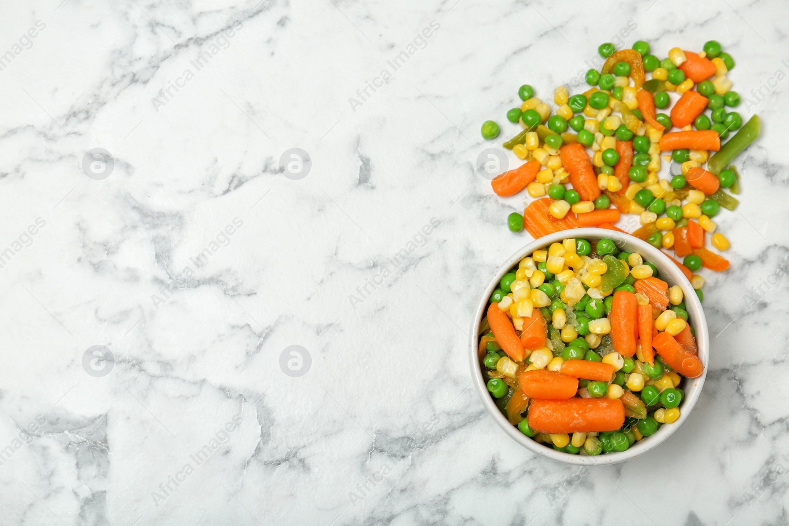 Photo of Flat lay composition with frozen vegetables on marble background