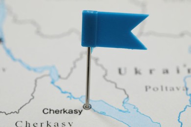 Photo of MYKOLAIV, UKRAINE - NOVEMBER 09, 2020: Cherkasy city marked with push pin on contour map of Ukraine, closeup
