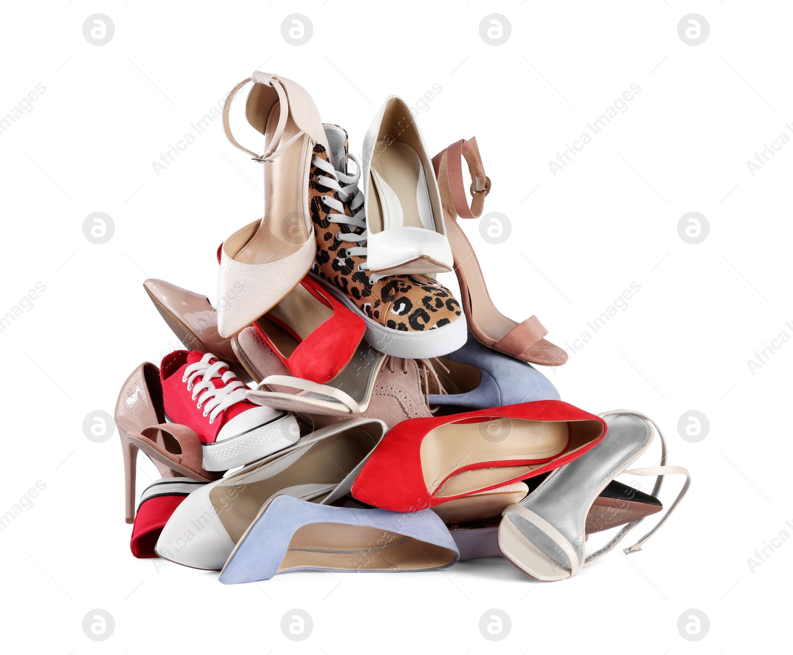 Photo of Pile of different female shoes isolated on white