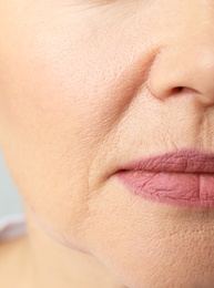 Beautiful older woman, closeup of lips