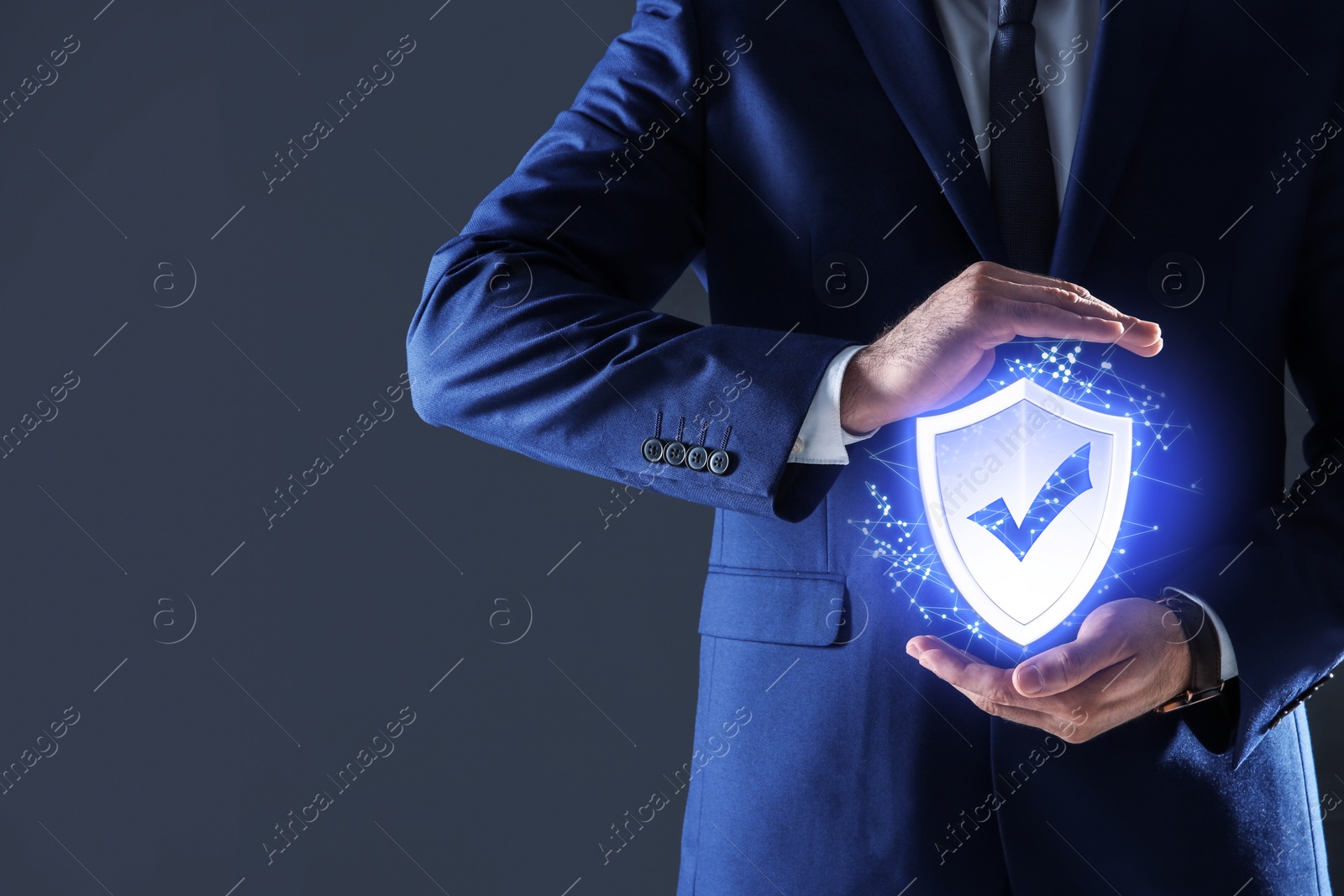 Image of Cyber insurance concept. Man demonstrating shield illustration as symbol of protection, closeup