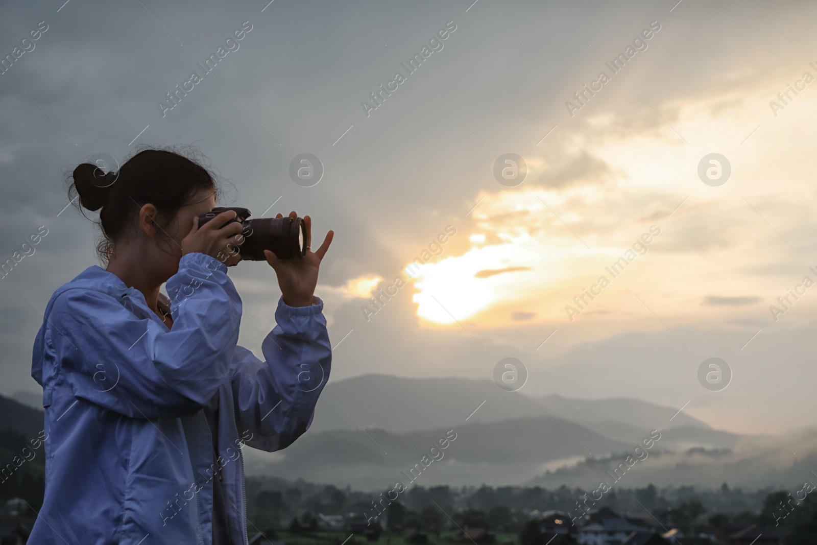 Photo of Professional nature photographer taking photos in mountains