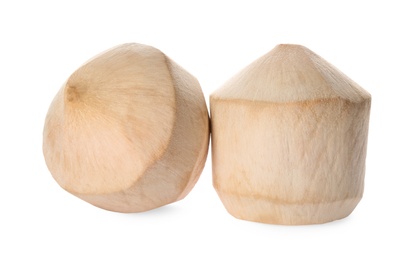 Fresh young peeled coconuts on white background
