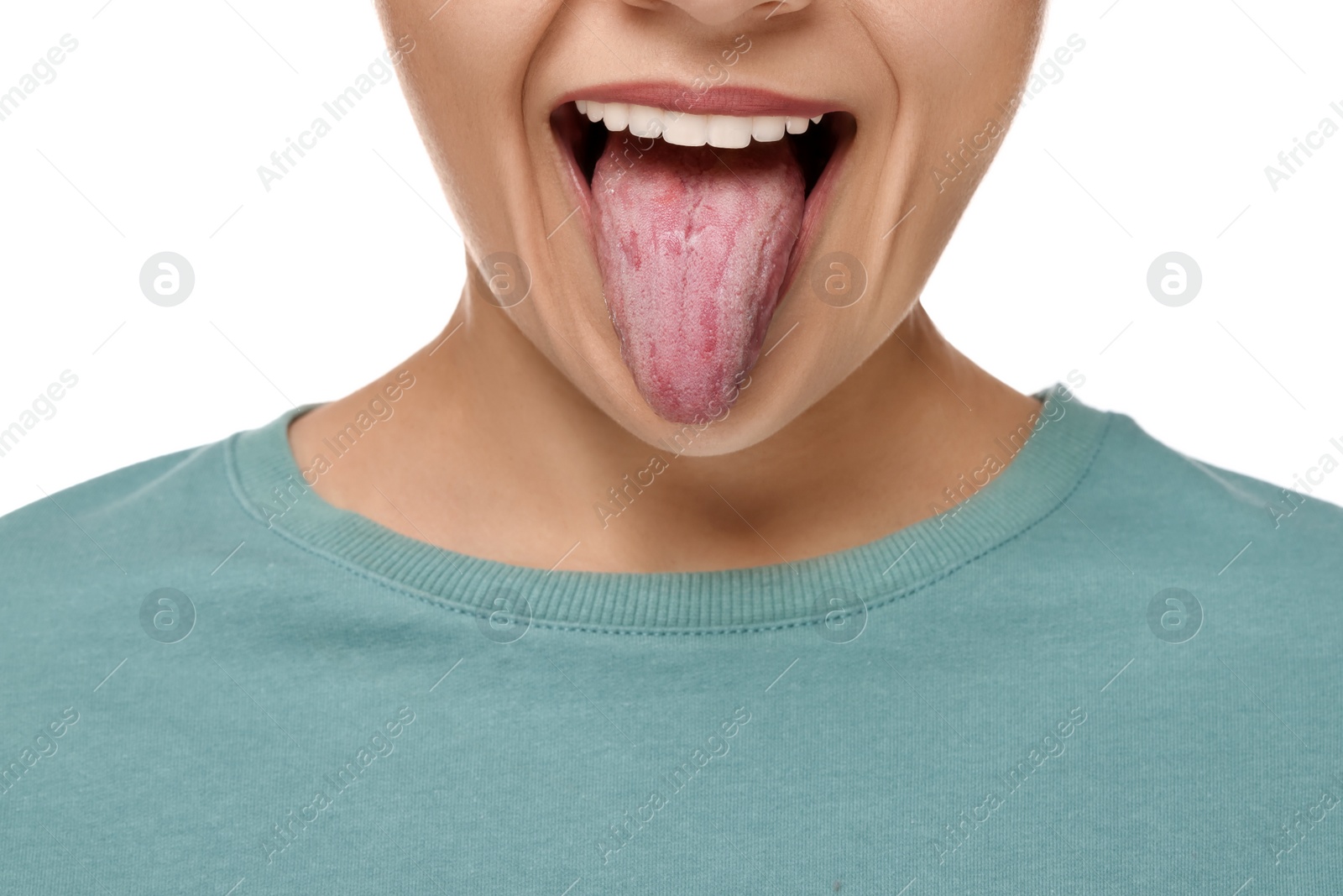 Photo of Happy young woman showing her tongue on white background, closeup