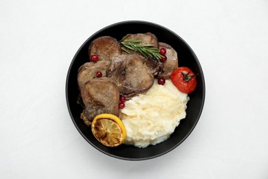 Photo of Tasty beef tongue pieces, berries, lemon, rosemary, tomato and mashed potatoes on white table, top view