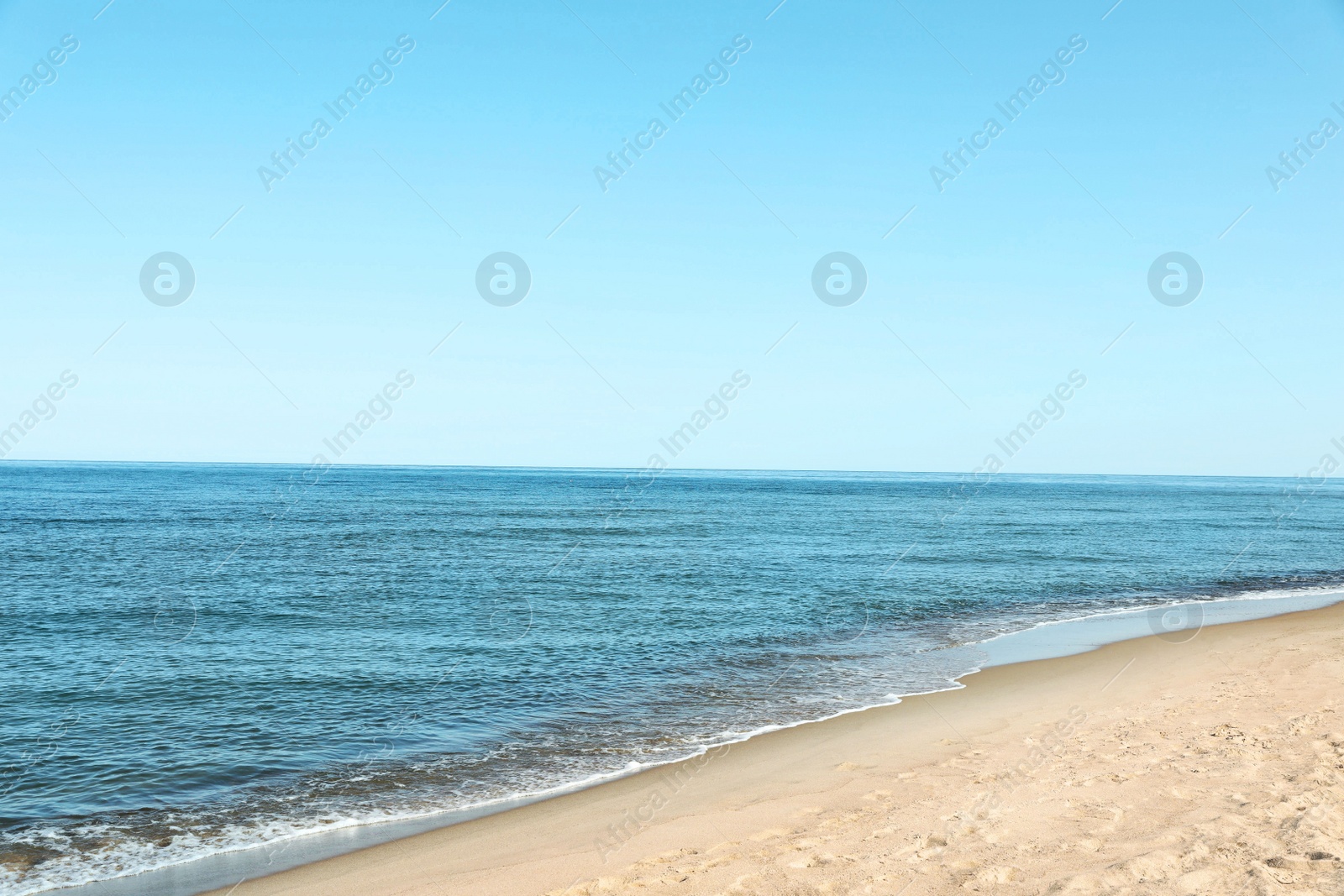 Photo of Picturesque view of sandy beach near sea