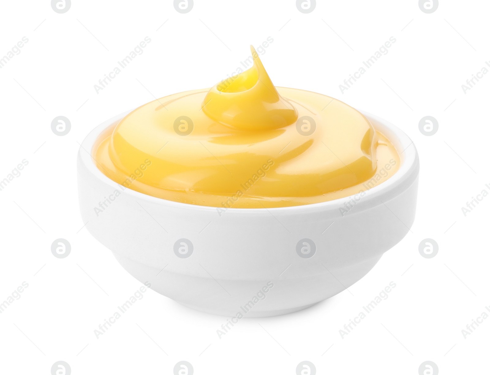 Photo of Delicious cheese sauce in bowl isolated on white