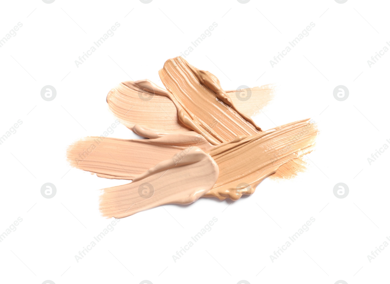 Photo of Samples of skin foundation on white background, top view