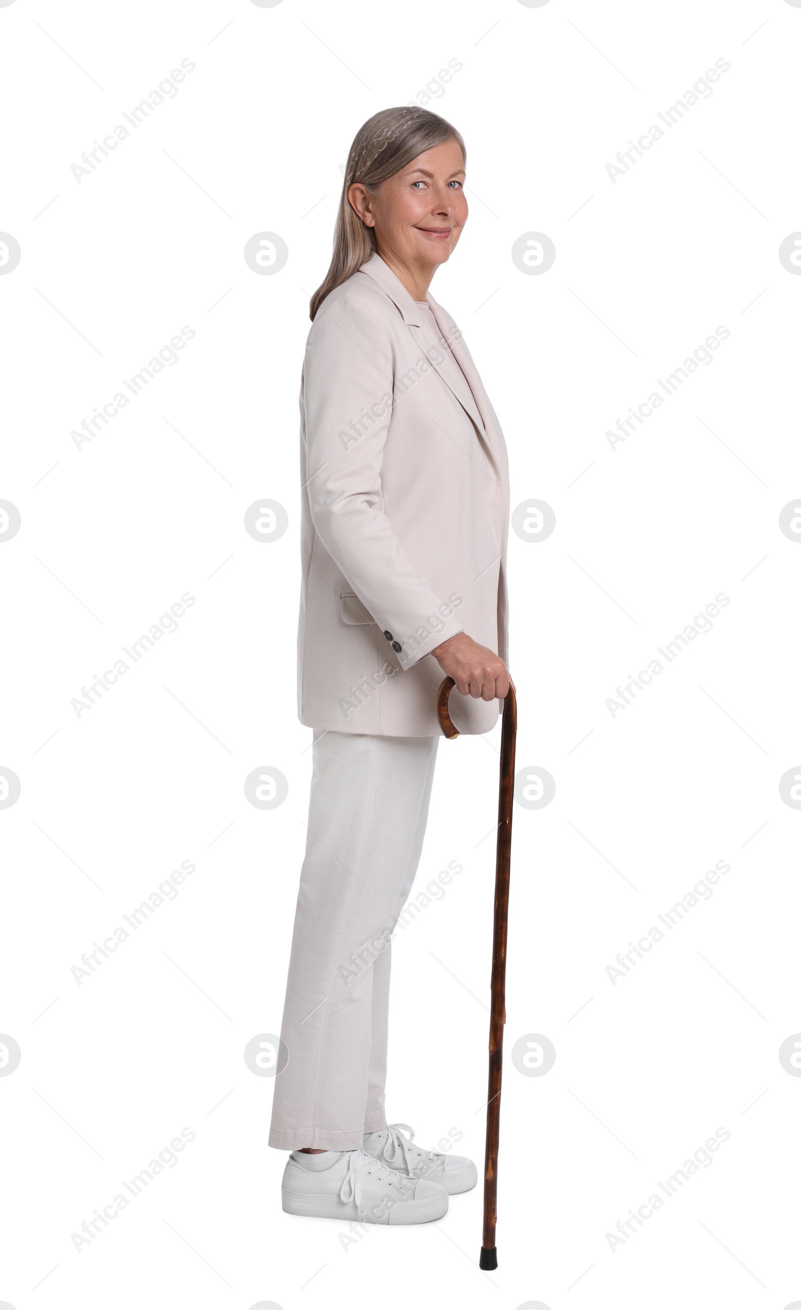 Photo of Senior woman with walking cane on white background