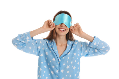 Beautiful woman wearing pajamas and sleep mask on white background. Bedtime