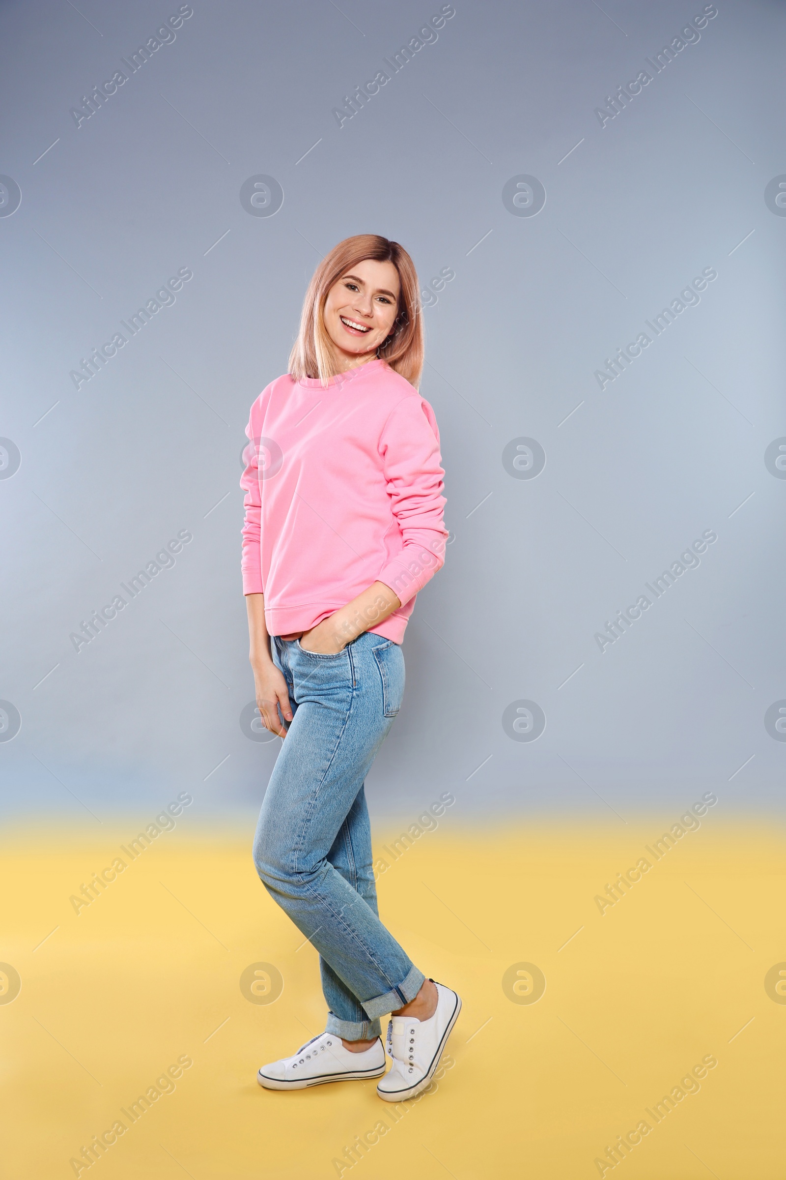 Photo of Full length portrait of beautiful woman on color background