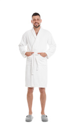 Photo of Handsome man wearing bathrobe on white background