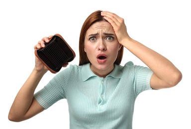 Confused woman with empty wallet on white background