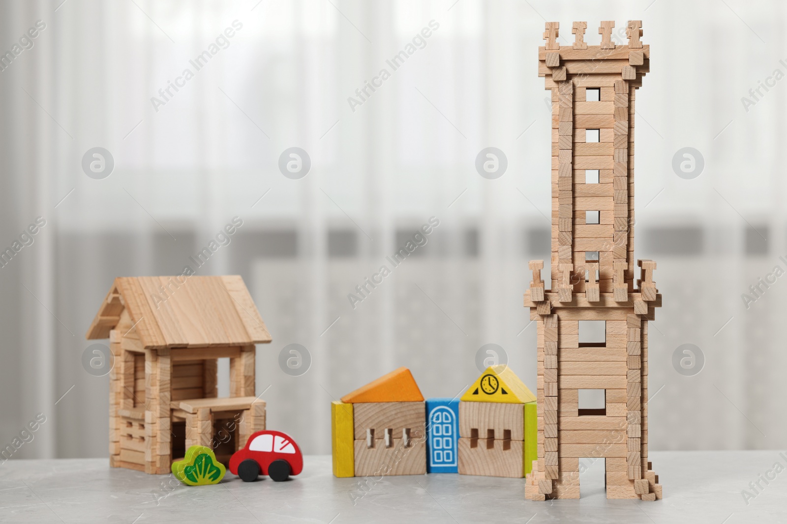 Photo of Set of wooden toys on table indoors. Children's development