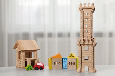 Photo of Set of wooden toys on table indoors. Children's development