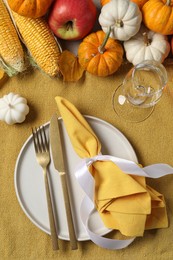 Photo of Happy Thanksgiving day. Beautiful table setting and autumn decoration, flat lay