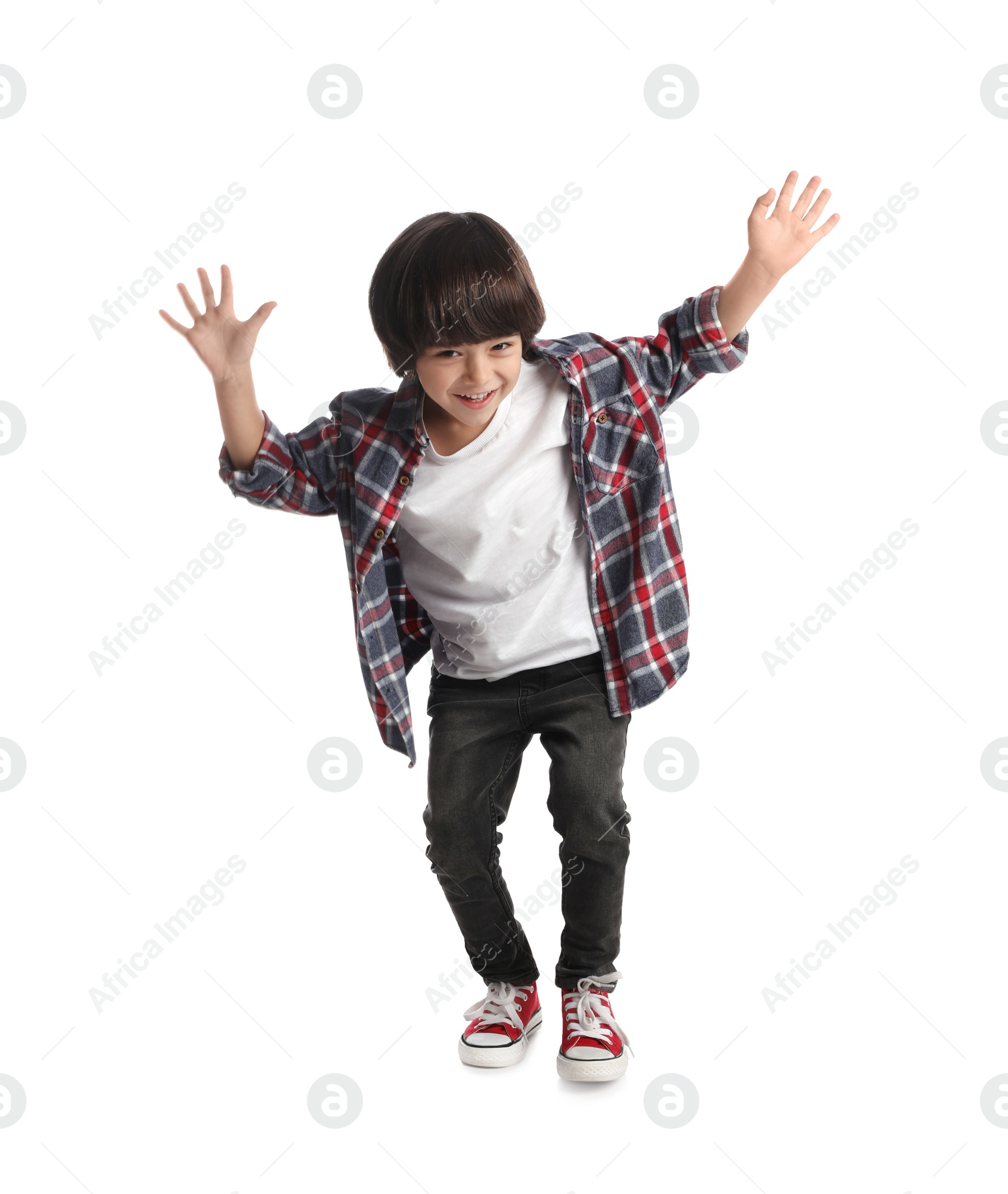 Photo of Cute little boy jumping on white background