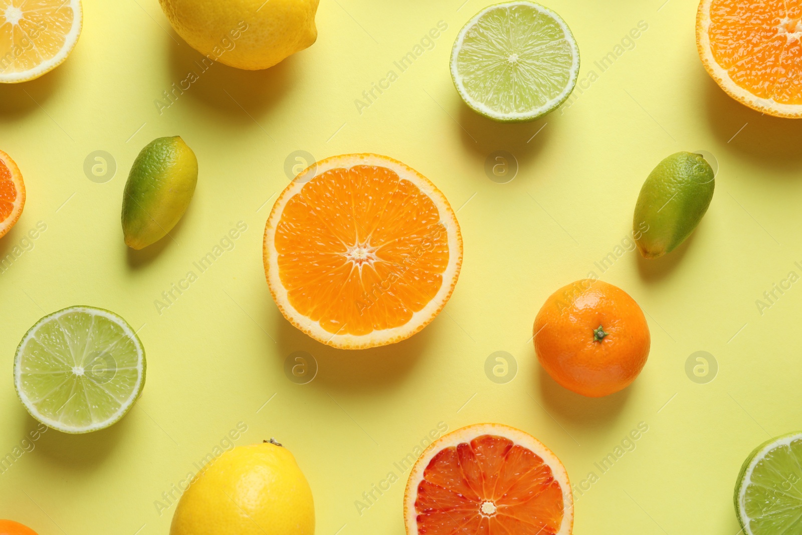 Photo of Different citrus fruits on color background, flat lay