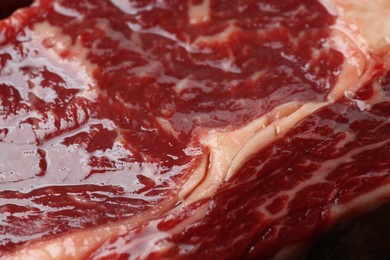 Texture of fresh beef meat as background, closeup