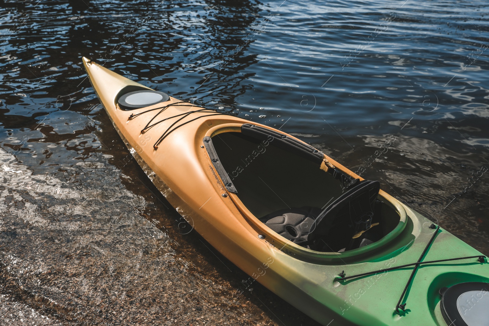 Photo of Modern kayak on river, closeup. Summer camp activity