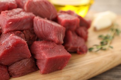 Pieces of raw beef meat on table, closeup. Space for text