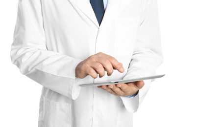 Photo of Male doctor holding modern tablet on white background, closeup