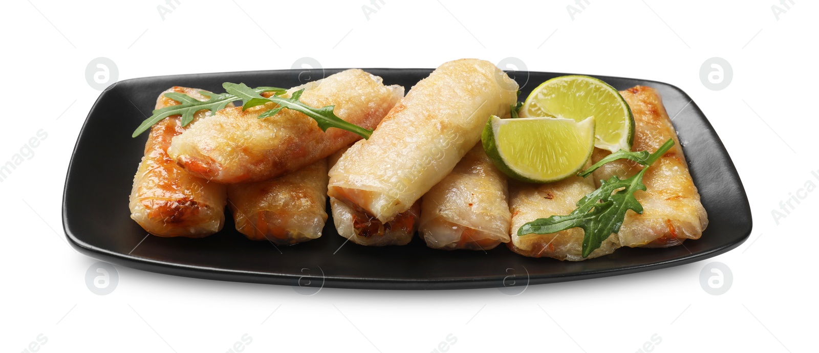 Photo of Tasty fried spring rolls, arugula and lime isolated on white