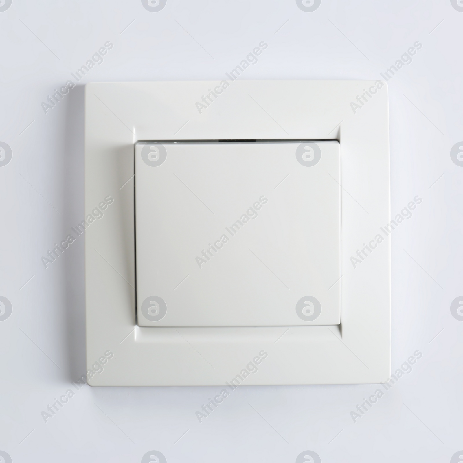 Photo of Light switch on white background. Electrician's equipment