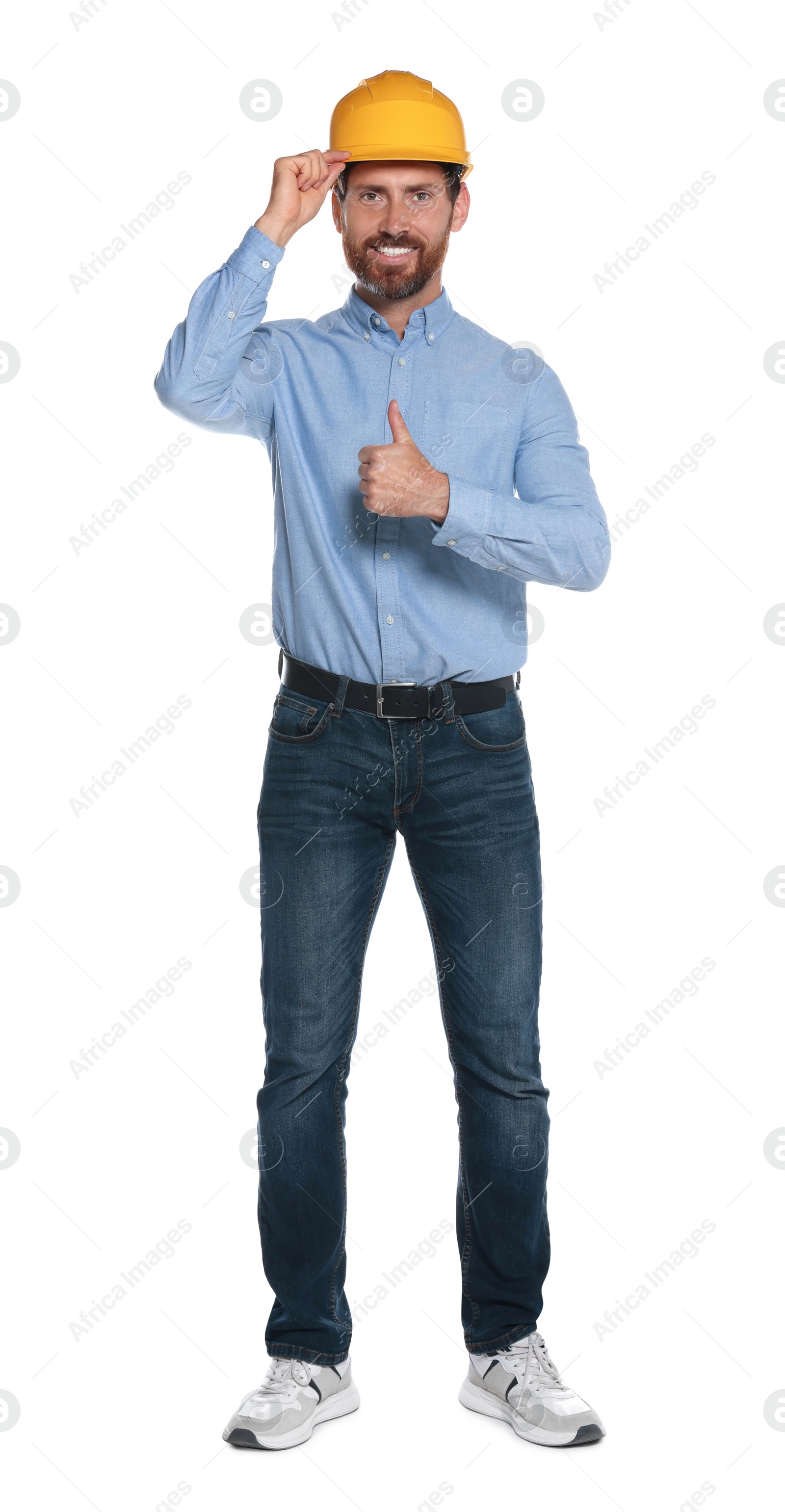 Photo of Professional engineer in hard hat showing thumb up isolated on white
