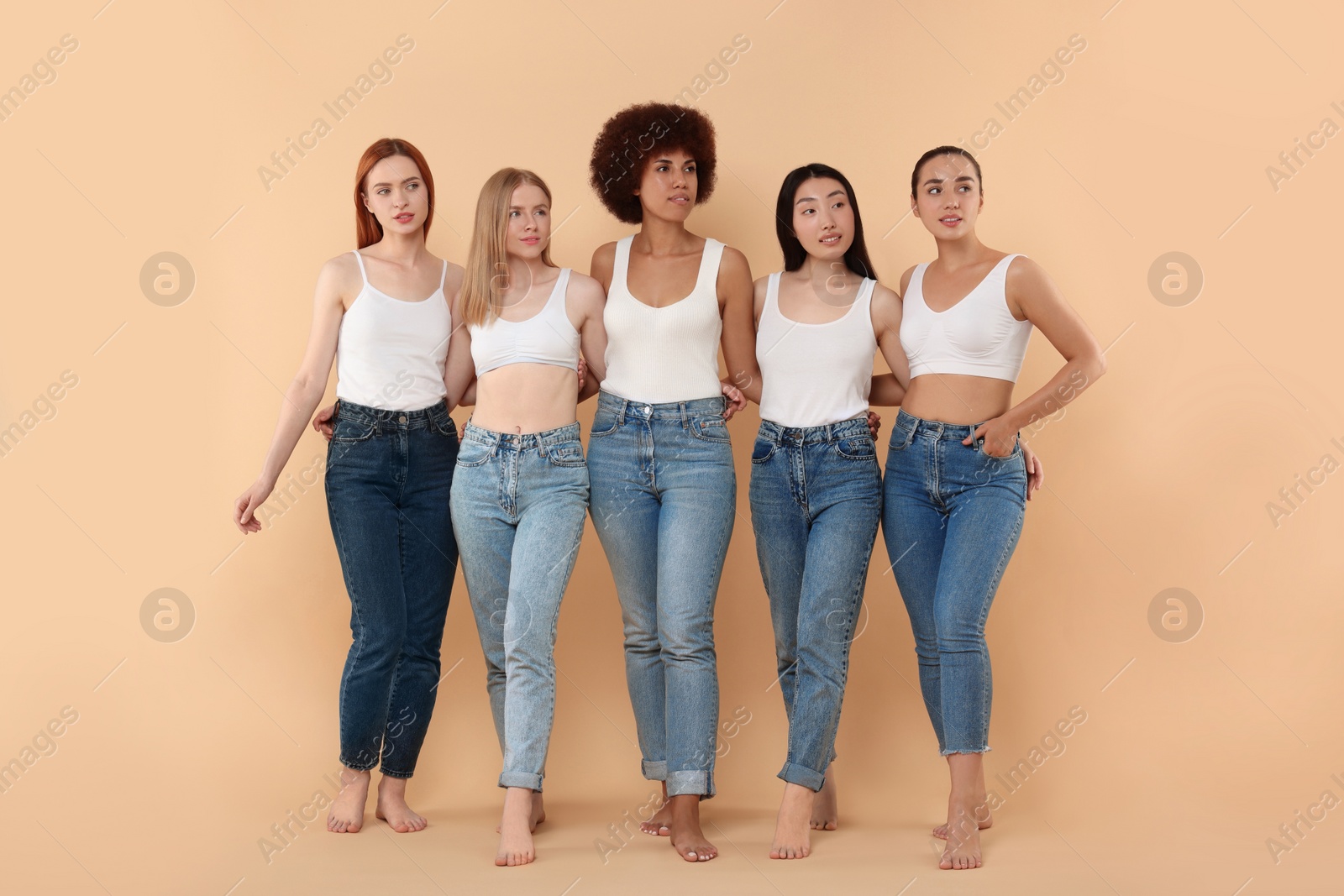 Photo of Group of beautiful young women on beige background