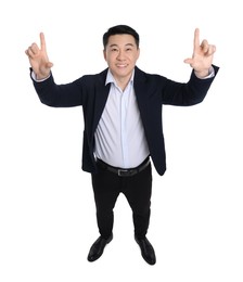 Photo of Businessman in suit posing on white background, above view