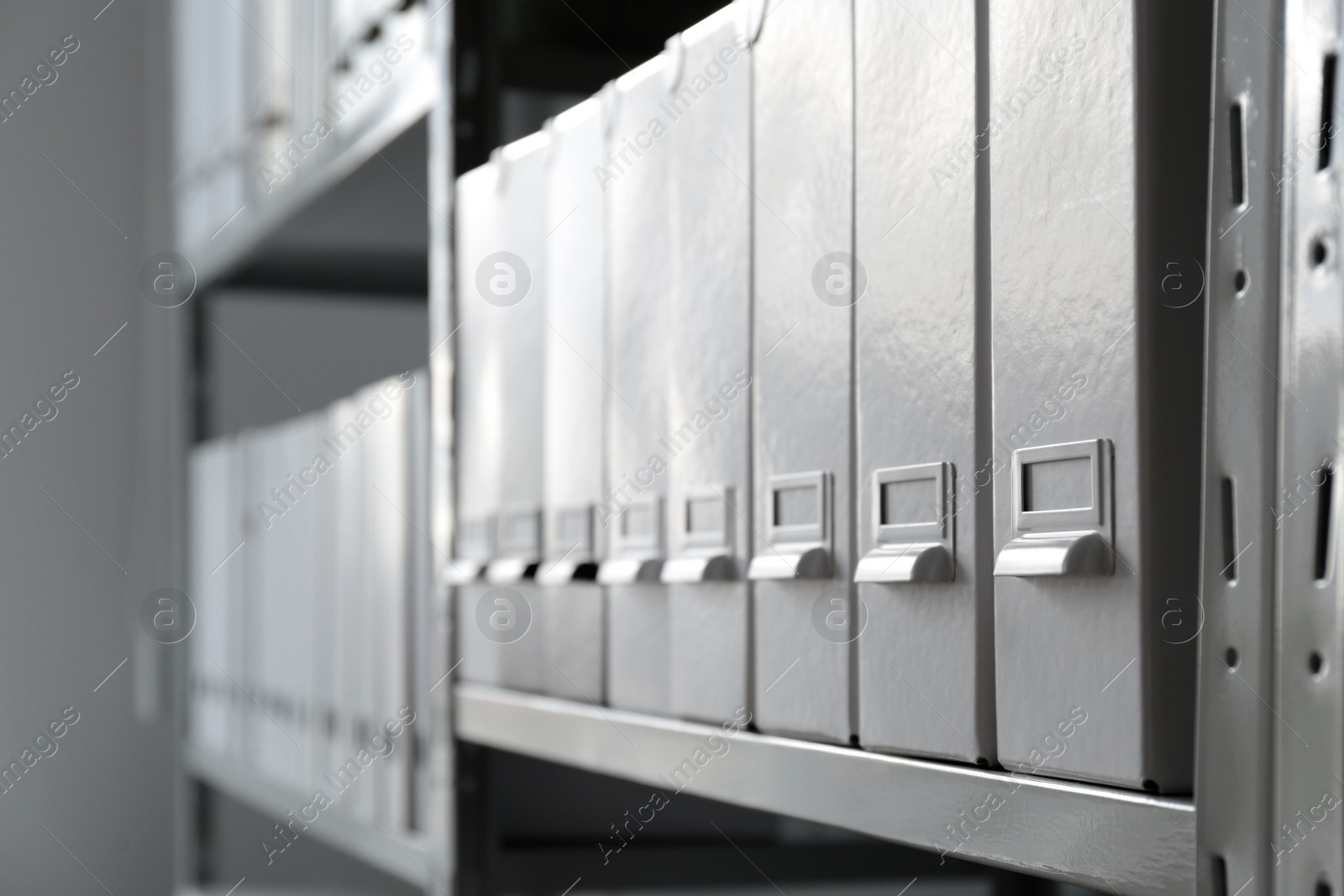 Photo of Folders with documents on shelf in archive