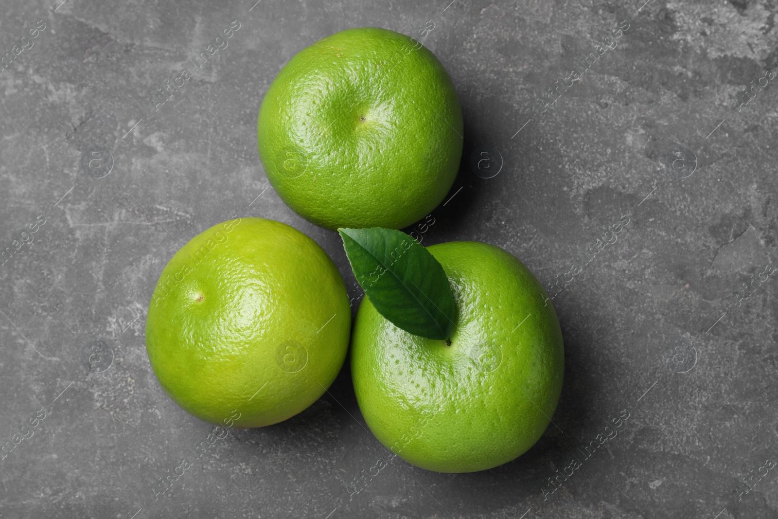 Photo of Fresh ripe sweeties on grey table, flat lay