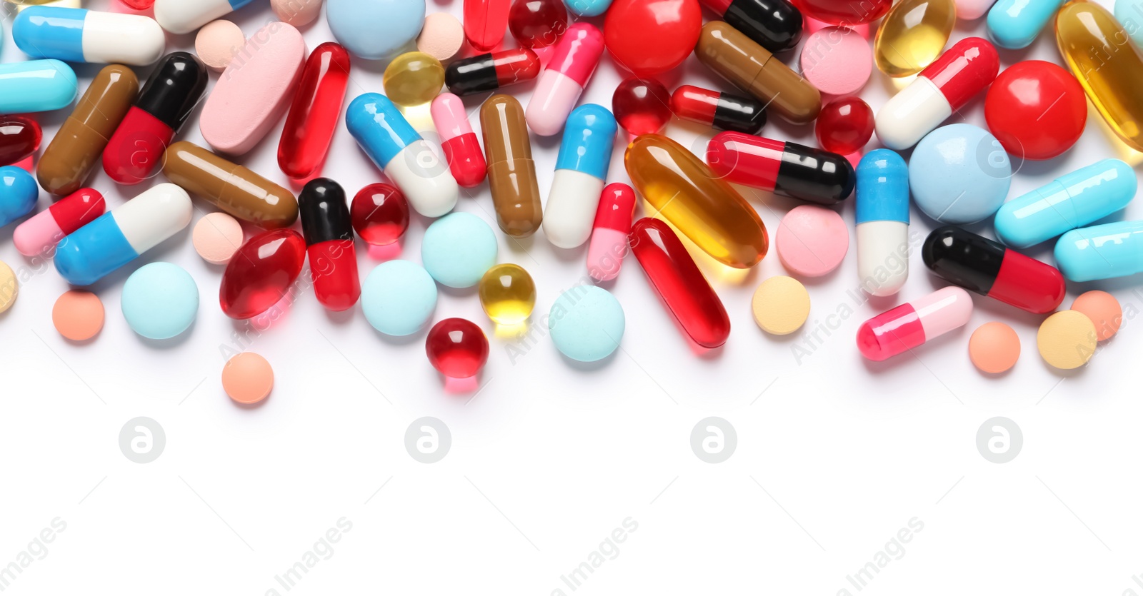Photo of Lots of different colorful pills isolated on white, top view
